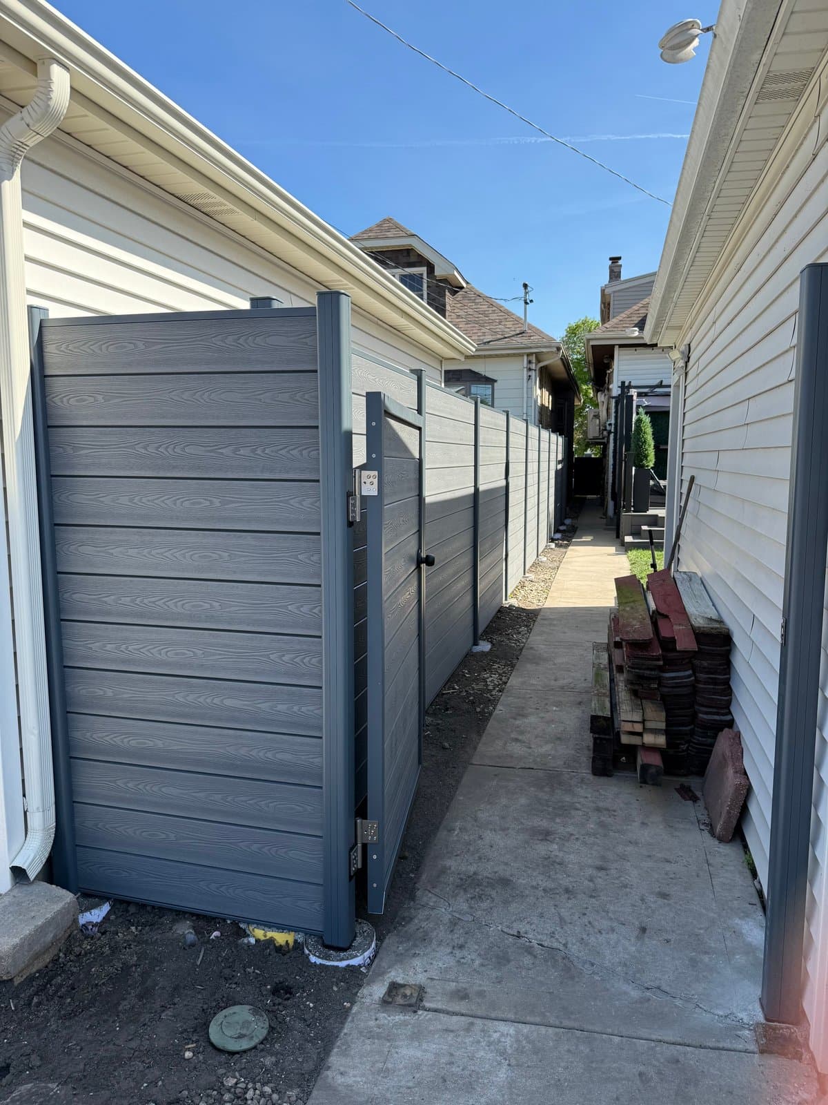 Custom wood fence installation view 1